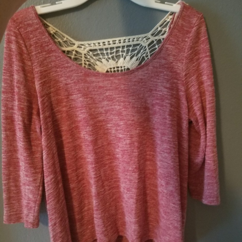 Red top with lace on the back.